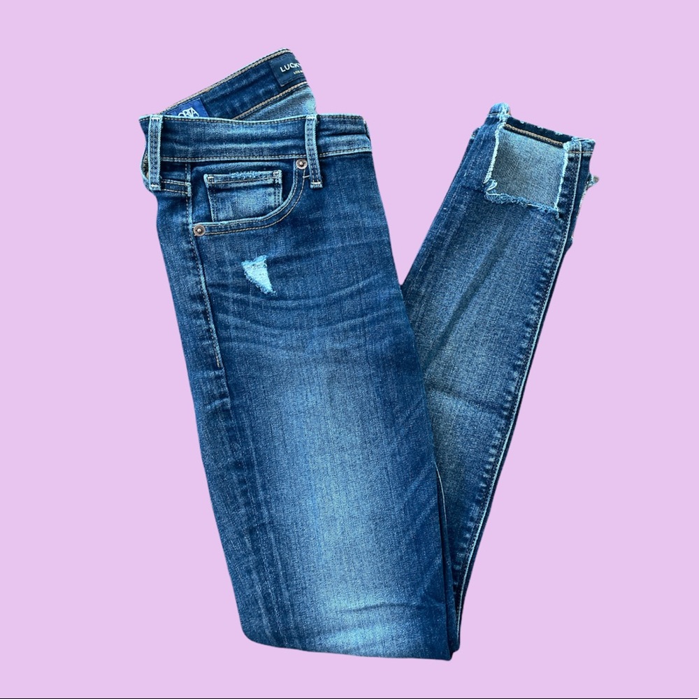 Distressed skinny jeans with ankle detail